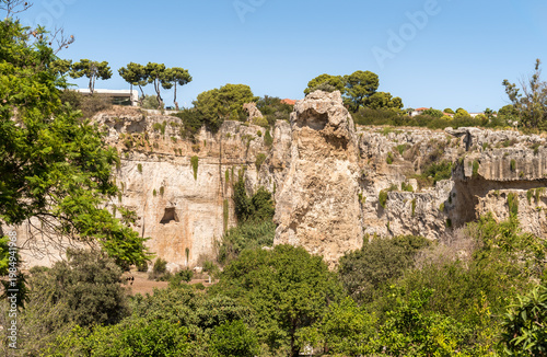Wallpaper Mural The Latomia del Paradiso inside the Neapolis Archaeological Park in Syracuse, Sicily, Italy. Historic archaeological site connected to Greek and Roman history. Torontodigital.ca