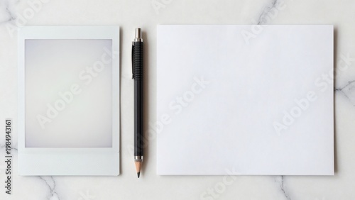 Minimalist Flat Lay with Blank Polaroid Frame Pencil and White Paper on Marble Copy Space