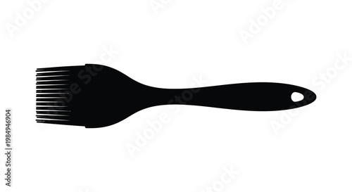 A black hair pick displayed in a stark contrasting silhouette