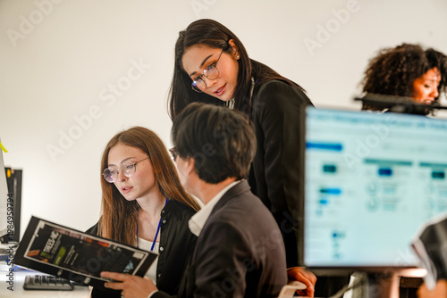 Fotografie Busy cybersecurity squad analyzing predictive analytics at a command center