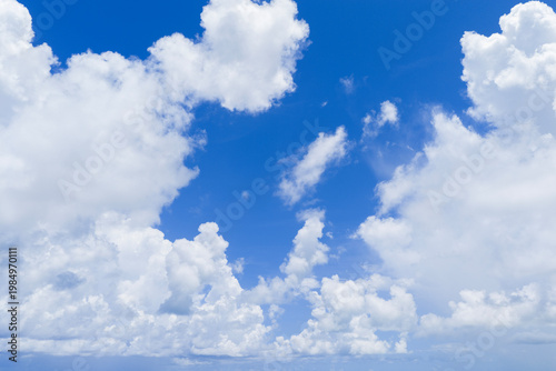 Cumulus clouds in the blue sky. Cloudscape background. Cloudy sky. Open sky. Clouds on the horizon. Skyscape background.