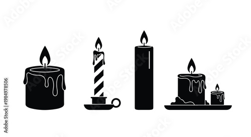 Set of four birthday candles with flames, including a striped candle, tall pillar, and small decorative candles