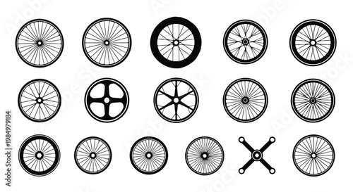 Collection of various black and white bicycle wheels and tires with different spoke patterns and sizes for cycling
