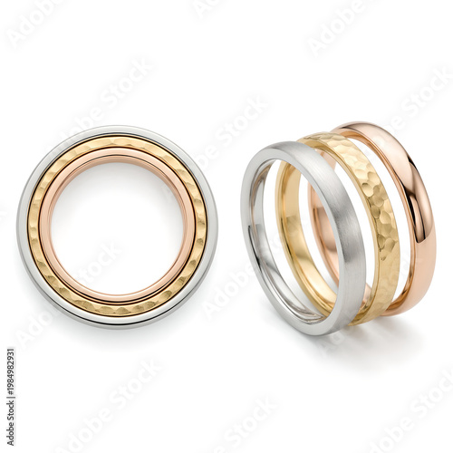 Two metal rings with gold and silver layers are stacked on each other.