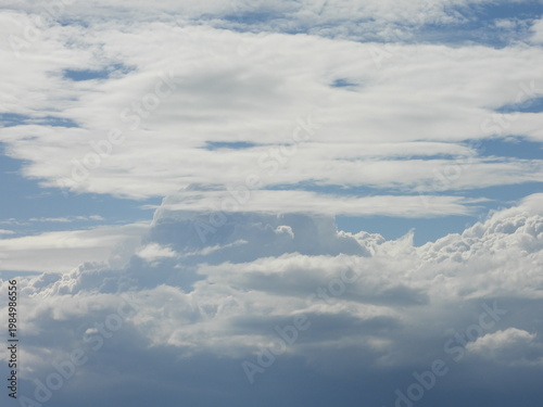 Cumulonimbus clouds forming within the blue, summer sky. Cloudscape, viewed over the Shenandoah Valley, from Shenandoah National Park, Virginia.