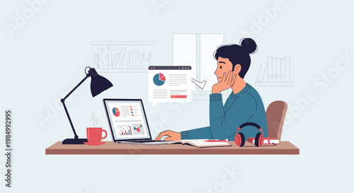 woman sitting at desk with laptop and papers.