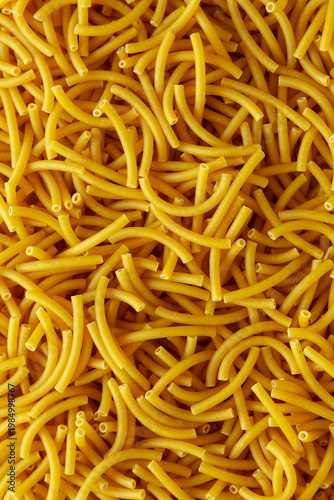Organic Dry Raw Macaroni Pasta, top view. Close-up.
