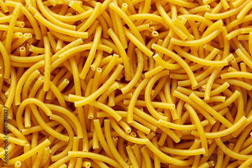 Organic Dry Raw Macaroni Pasta, top view. Close-up.
