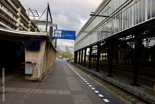 Railway platform area at Haarlem station with tracks and urban surroundings. The scene reflects everyday transportation and city infrastructure.
