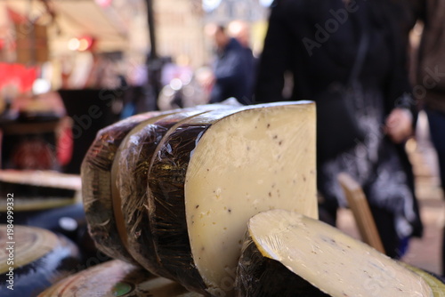Traditional Dutch cheese displayed at an outdoor market in Haarlem.