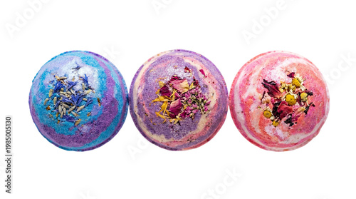 Quadro su tela Three colorful bath bombs with dried flowers and herbs, isolated on transparent