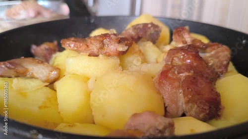 aromatic stewed potatoes in a deep plate. 