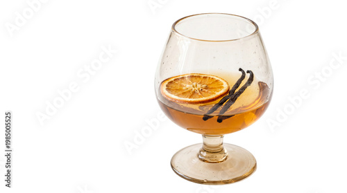 Фотография Amber liquid in brandy snifter with orange slice and vanilla beans, isolated on