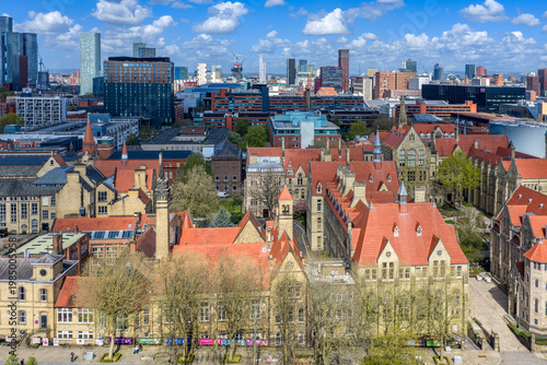 cumulus clouds and blue skies above University of Manchester