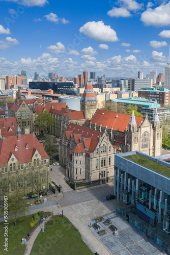 University of Manchester cityscape with cumulus clouds