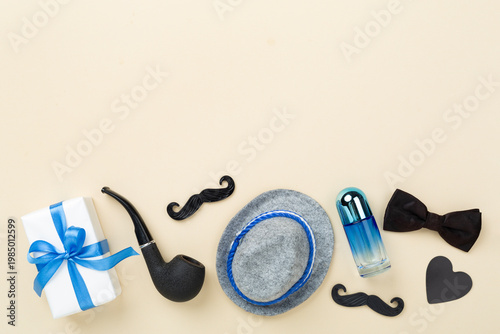 Happy Father's Day accessories on color background, top view