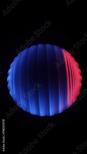 Circular red and blue LED light glowing against black background.