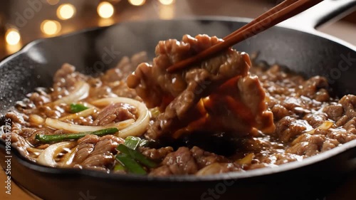 Aerial drone view of a serene lake at sunset, reflecting trees and sky