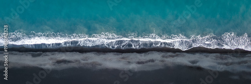 Aerial View of Teal Ocean Waves Meeting Black Sand Beach Iceland