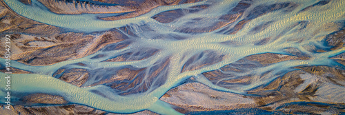 Bild auf Leinwand Panorama Aerial View of Glacial River Delta Meeting Ocean in Iceland