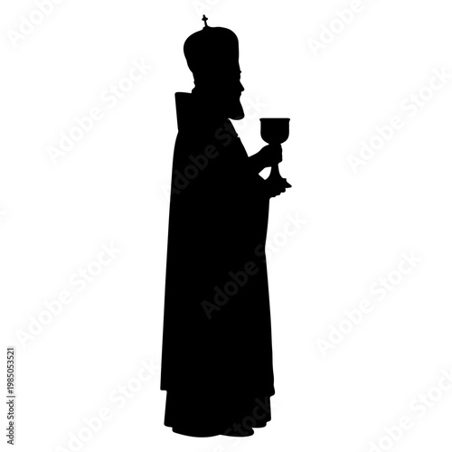 Silhouette of a priest holding a chalice.