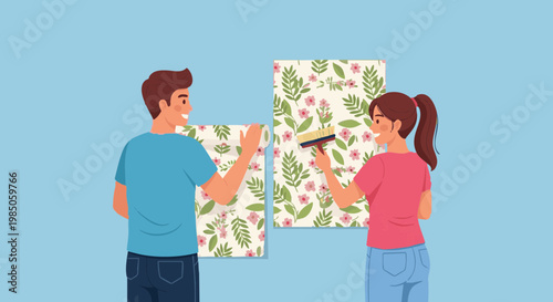 Happy young couple decorating new home together hanging floral wallpaper