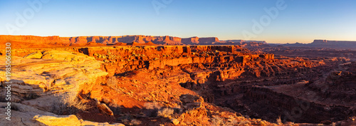 This scenic sunrise panorama of Canyonlands National Park near Moab, Utah, was captured from deep within the park.