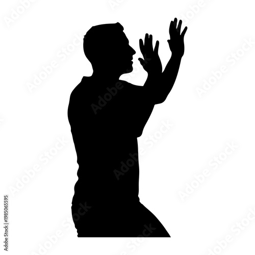 Silhouette of a man kneeling and praying with hands raised.