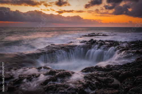El Bufadero geological vent in La Garita at sunrise, Gran Canaria island, Spain. Waves crashing at natural underwater arch. Natural landmark. March 2026, long exposure picture