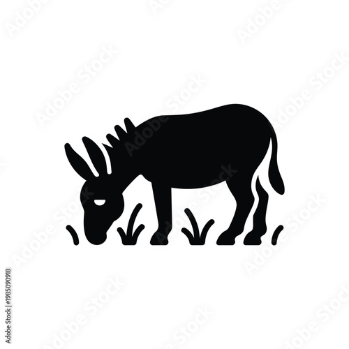 A simple black silhouette of a donkey grazing in tall grass