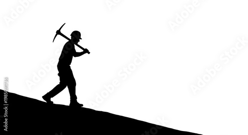 A silhouette of a man carrying a pickaxe on his shoulder walking up a hill