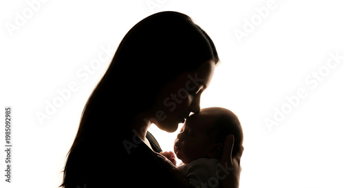 A silhouette of a mother tenderly kissing her baby on a white background
