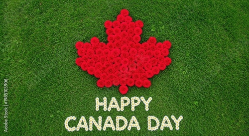 Happy canada day text spelled with daisies on green grass next to large red maple leaf made of flowers, symbolizing national pride and summer celebration.