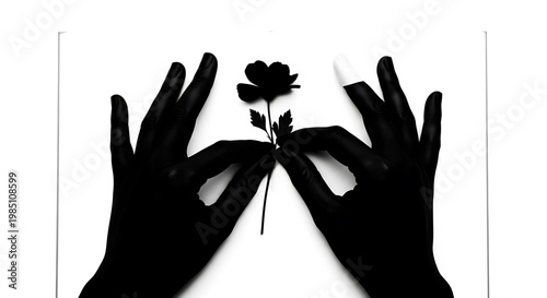A pair of gloved hands holding a delicate flower against a clean white background