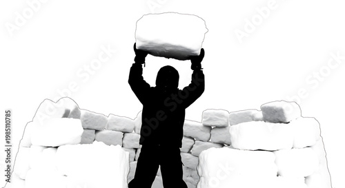 A silhouette of a man building a wall with large blocks of stone
