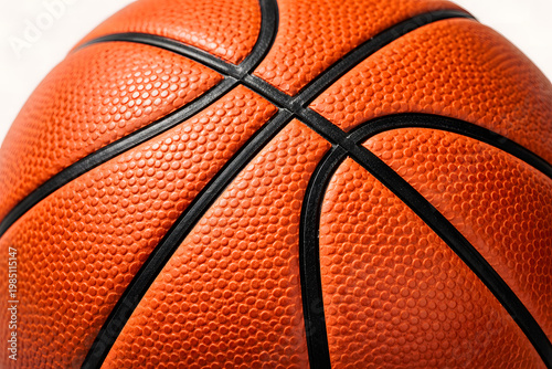 Close up texture of orange basketball surface with black curved lines