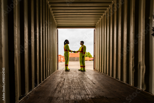 Bild auf Leinwand Successful handshake between diverse logistics specialists after a deal