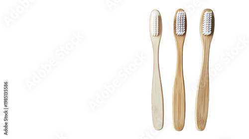 Three bamboo toothbrushes on transparent background for eco-friendly oral care