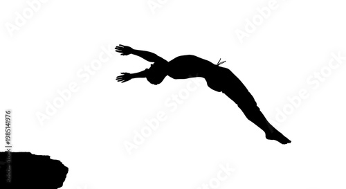 A silhouette of a person jumping off a cliff into the air