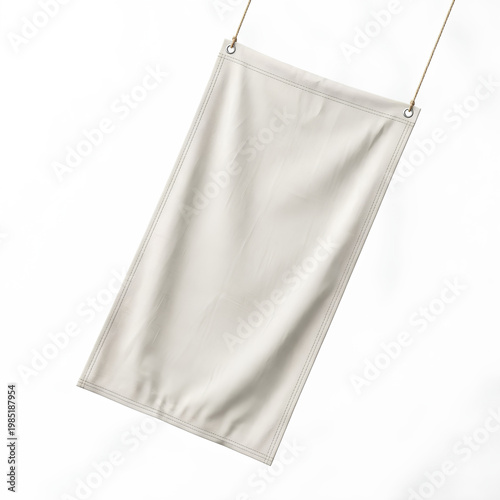 Plain white banner hanging with metal rings and thin wire for display.
