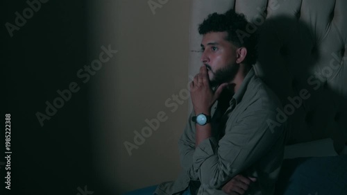 Stressed worried man at bedroom with insomnia and anxiety