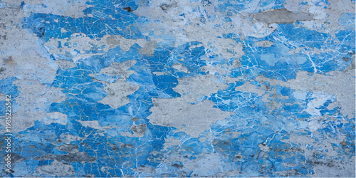 A rough blue paint texture on a vintage grunge wall surface creates a cold winter design with marble and stone patterns