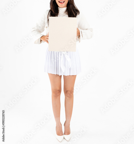 Asian woman body in white short skirt holding plain gift box, isolated on white background