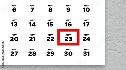 The date May 23rd marked with a red cursor on the wall calendar 2026