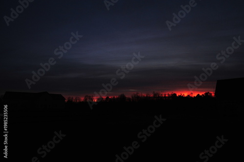 Just a sliver of red in a dark sky