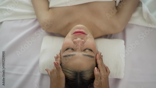 The pretty woman is relaxing at hotel 's massage  and spa. Lifestyle, leisure activity.