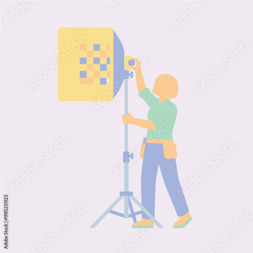 Person Adjusting a Photography Studio Light Setup.