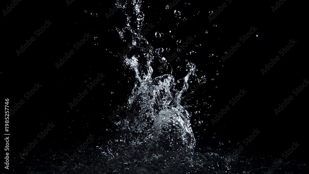Obraz premium Dynamic Water Splash Frozen in Time Against a Dark Background.