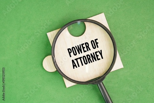 Magnifying glass and puzzle with the word Power of attorney. legal authorization for a designated person to make decisions about another person's property, finances, or medical care.