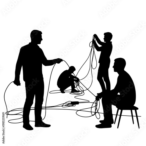 Silhouette of a team of technicians managing cables and wires during setup